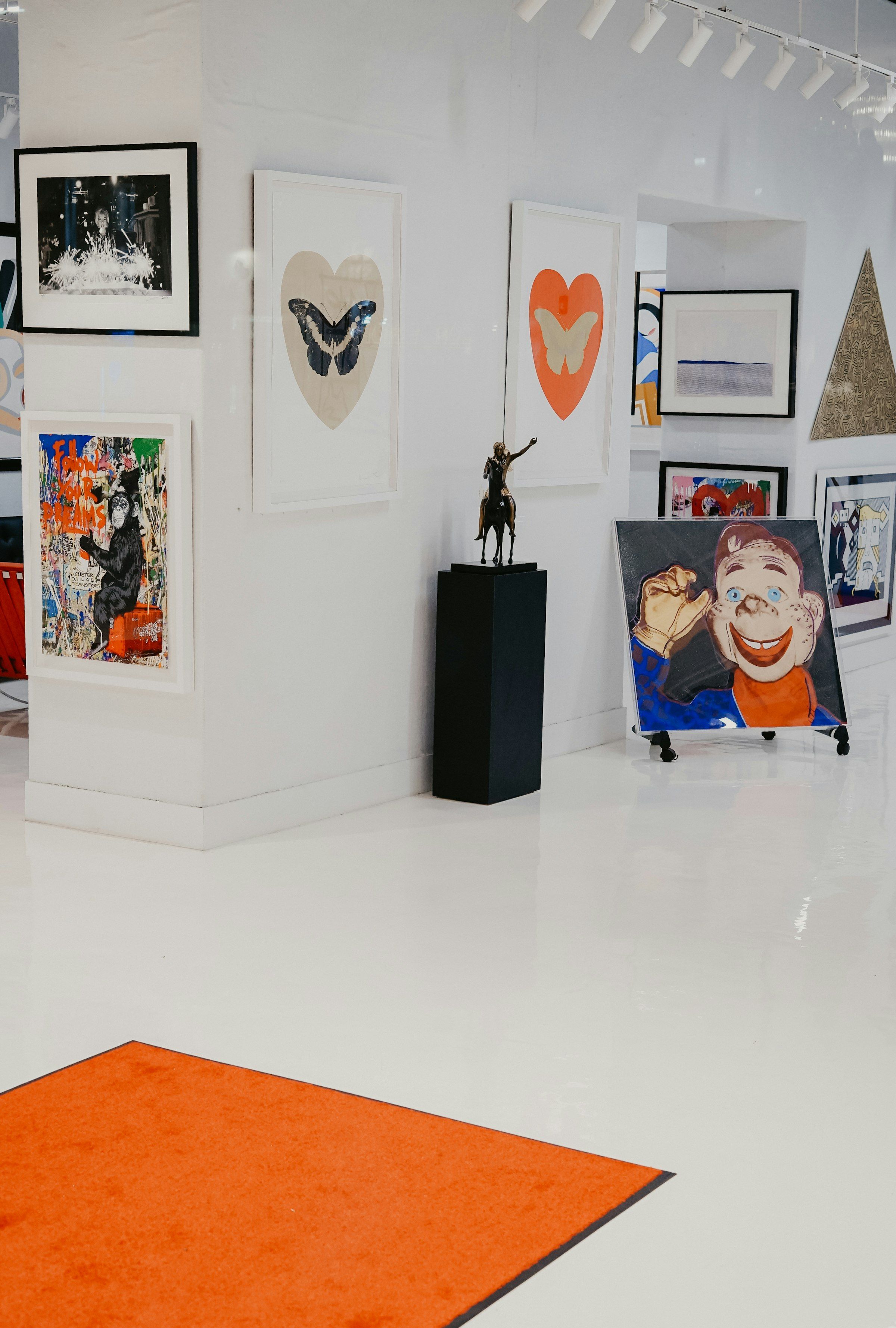 Paintings hung in a gallery